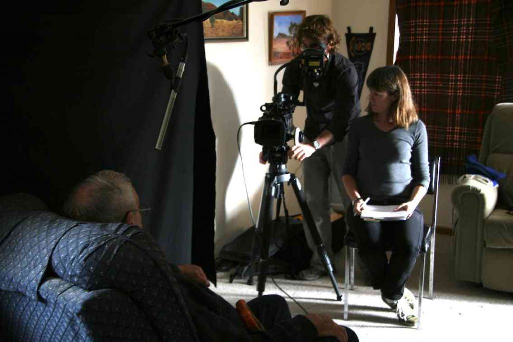 Video interview setup showing the director and Chris Cooper